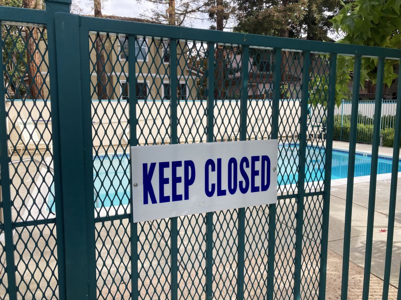 Mesh Fence Secured to Pool Deck